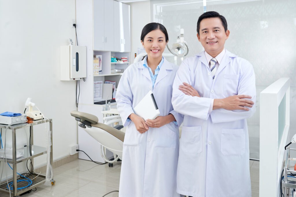 Cheerful dentist and nurse